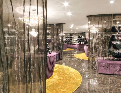 new structuring of the sales area - modern development concept - department store - Jelmoli Zurich - lingerie department - separation by shiny semipermeable curtains