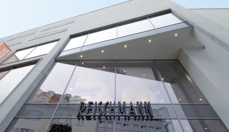 fashion store for sports and trends - reconstruction - Reischmann Sport Kempten - outside facade - entrance area - glass wall elements - logo sign
